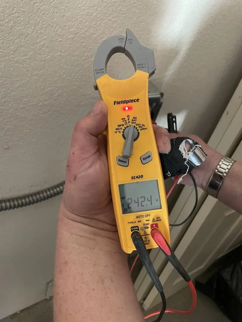 Voltage testing with clamp meter during Ceiling Fan Installation in McFarland